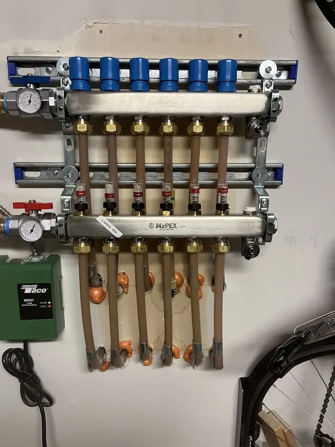 Plumber performing Water Heater Repair at a residential property in Hopkinton